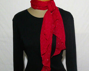 This scarf can be tied multiple different ways. Because it's nice and long at 66 inches, the fabric falls nicely.